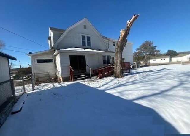 view of snow covered house