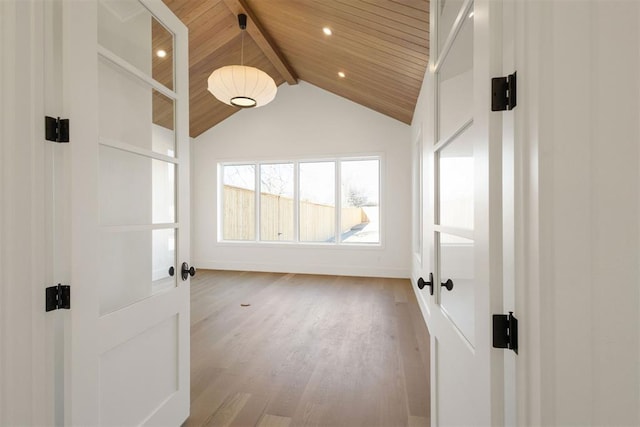 corridor featuring wood ceiling, wood-type flooring, french doors, and vaulted ceiling with beams