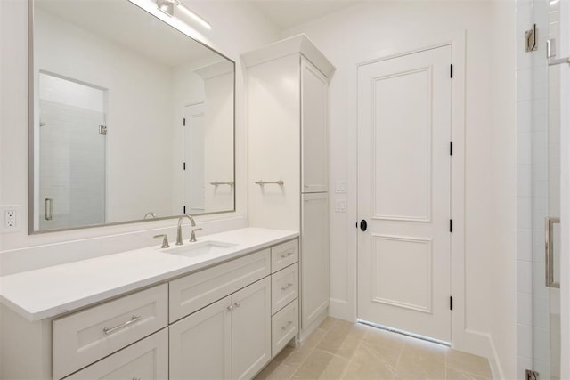 bathroom featuring vanity, an enclosed shower, and tile patterned flooring