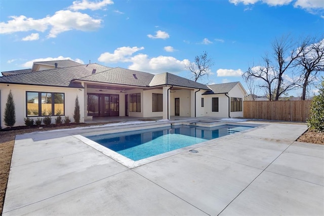 view of swimming pool featuring ceiling fan and a patio