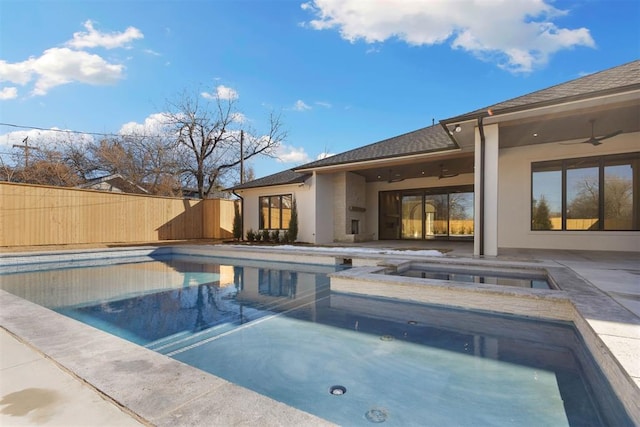 view of pool with an in ground hot tub, a patio area, and ceiling fan