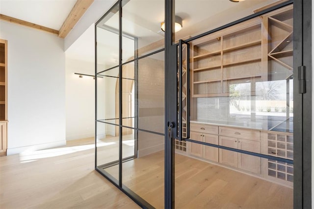 wine room with light hardwood / wood-style flooring