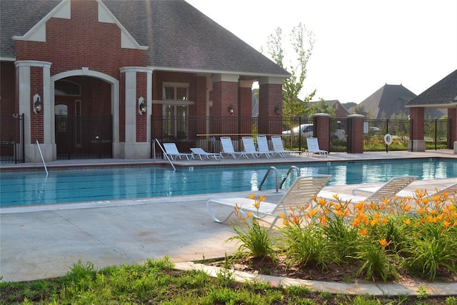 view of swimming pool featuring a patio area