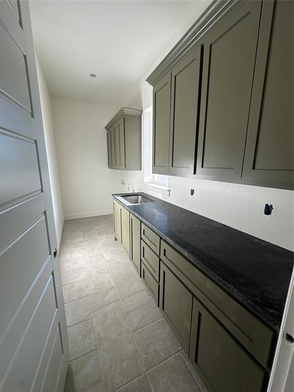 laundry area with a sink