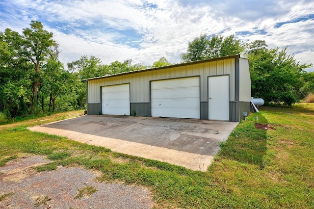 garage with a yard