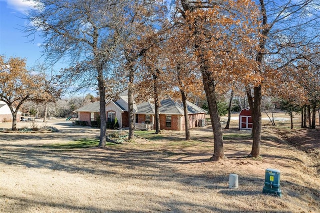 view of front of house featuring a shed