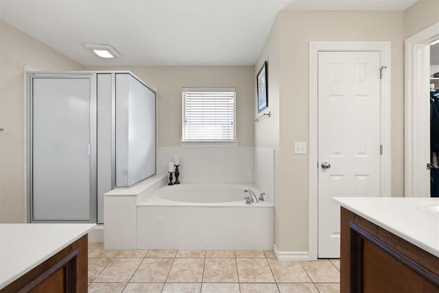 bathroom featuring tile patterned floors, vanity, and independent shower and bath