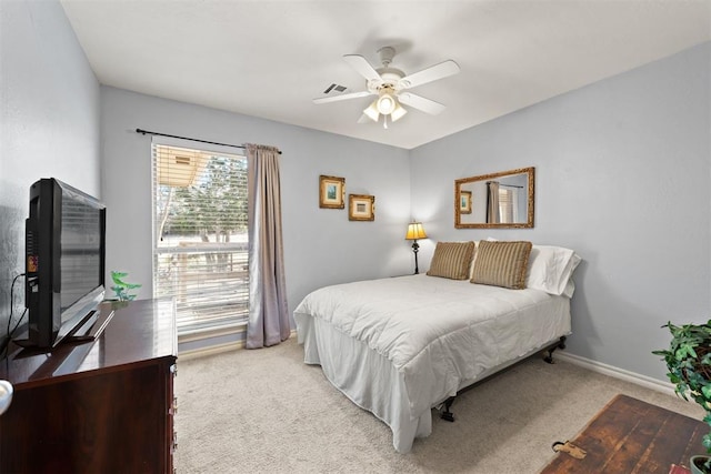 bedroom with light colored carpet and ceiling fan