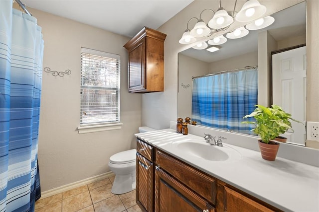 bathroom featuring toilet, vanity, tile patterned floors, and a notable chandelier