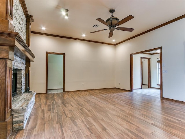 unfurnished living room featuring a fireplace, light hardwood / wood-style flooring, ceiling fan, and ornamental molding