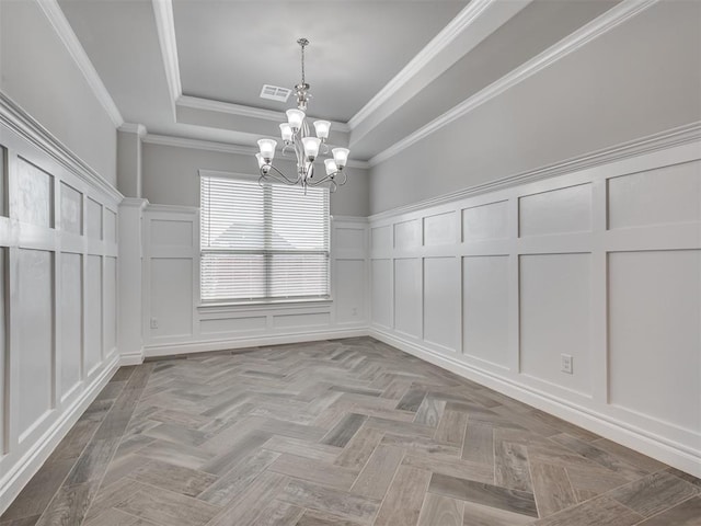 unfurnished dining area with light parquet floors, crown molding, a tray ceiling, and an inviting chandelier