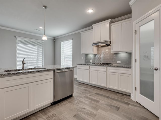 kitchen with sink, light stone counters, stainless steel dishwasher, pendant lighting, and white cabinets