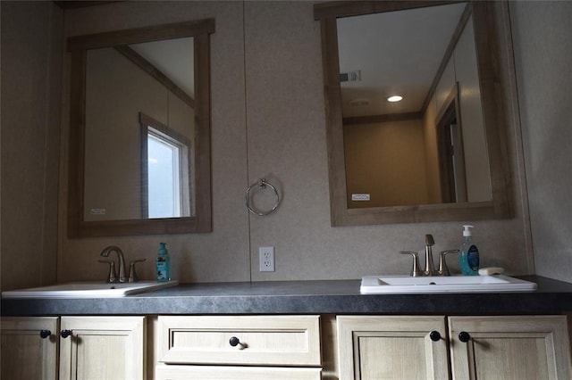 bathroom featuring visible vents and vanity