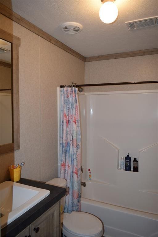 full bathroom with visible vents, shower / tub combo, and ornamental molding