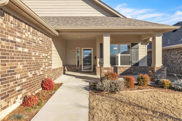 entrance to property featuring covered porch