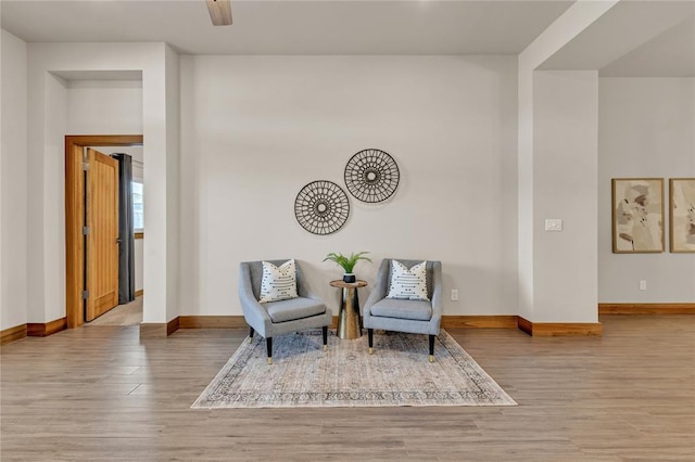 sitting room featuring light hardwood / wood-style floors