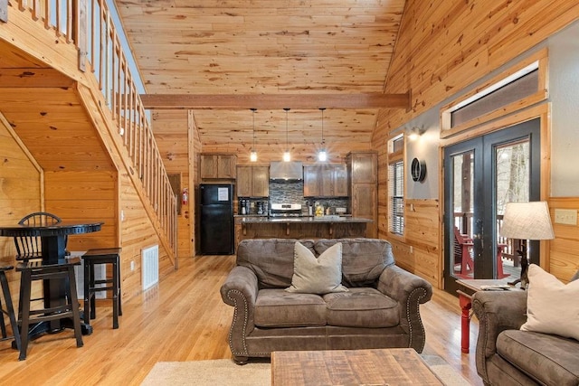 living room with high vaulted ceiling, light hardwood / wood-style flooring, and wood ceiling