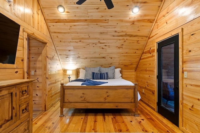 bedroom with wooden ceiling and wooden walls