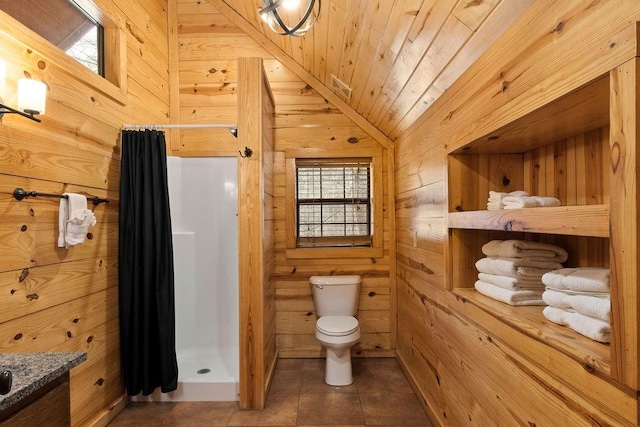 bathroom with lofted ceiling, toilet, tile patterned floors, wood walls, and wooden ceiling