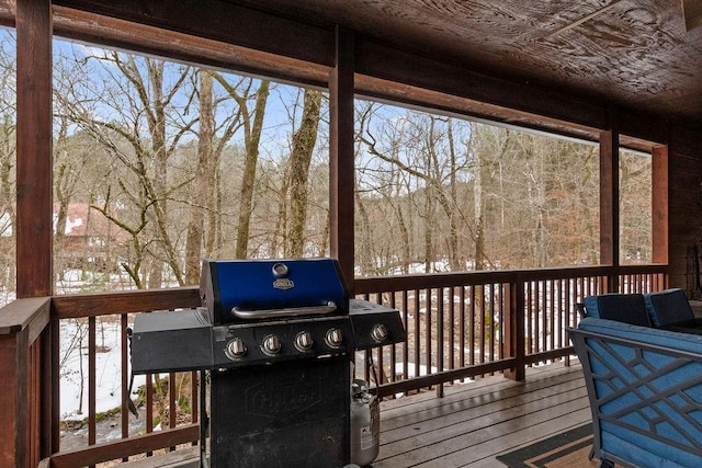 wooden deck featuring grilling area