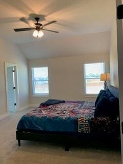 bedroom featuring carpet, vaulted ceiling, and ceiling fan