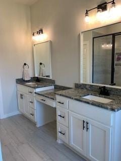 bathroom featuring hardwood / wood-style floors and vanity