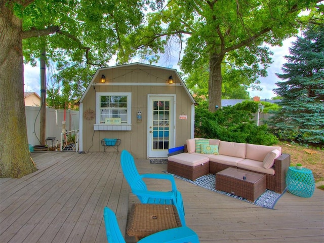 deck featuring an outdoor hangout area and an outdoor structure