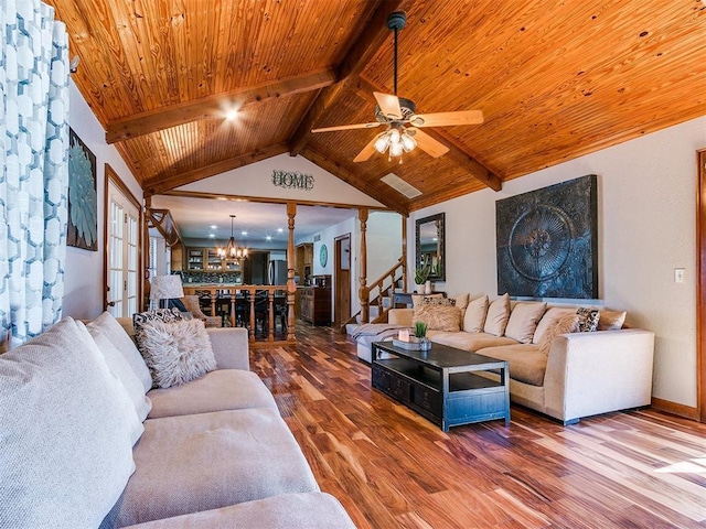 living room featuring vaulted ceiling with beams, wood-type flooring, ceiling fan with notable chandelier, and wooden ceiling