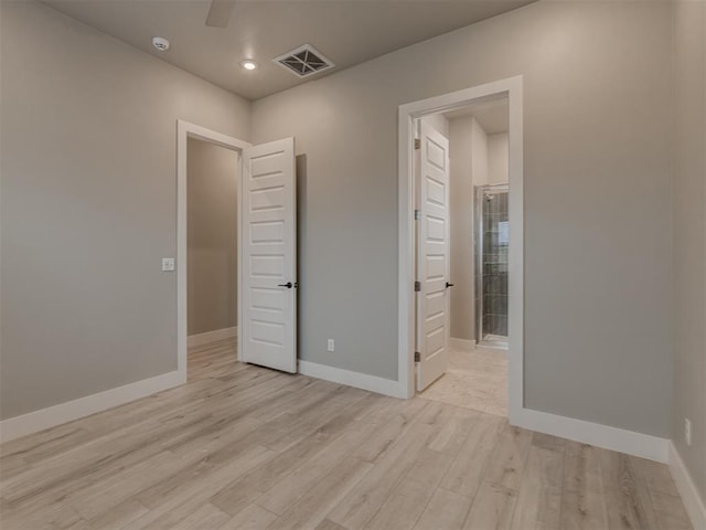 unfurnished bedroom featuring ceiling fan and light wood-type flooring