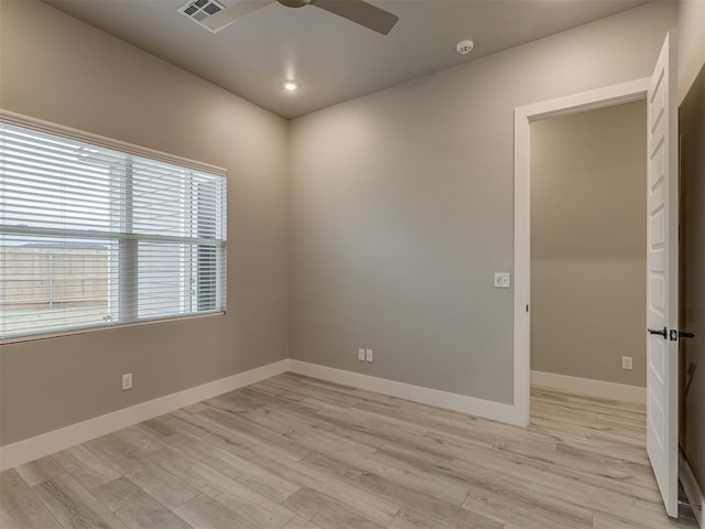 unfurnished room with light wood-type flooring and ceiling fan