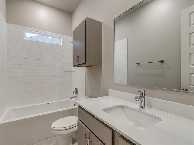 full bathroom with toilet, vanity, and tub / shower combination