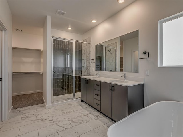 bathroom featuring plus walk in shower and vanity