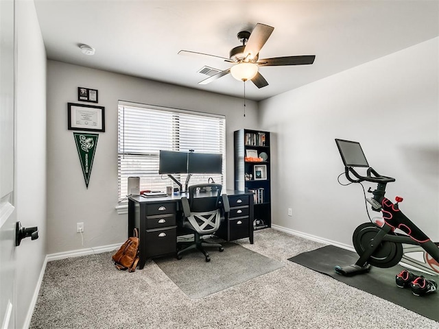 office featuring ceiling fan and light carpet