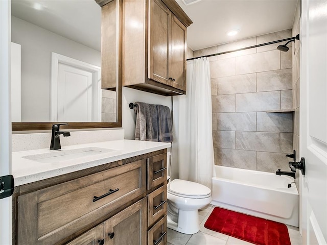 full bathroom featuring toilet, vanity, tile patterned flooring, and shower / tub combo