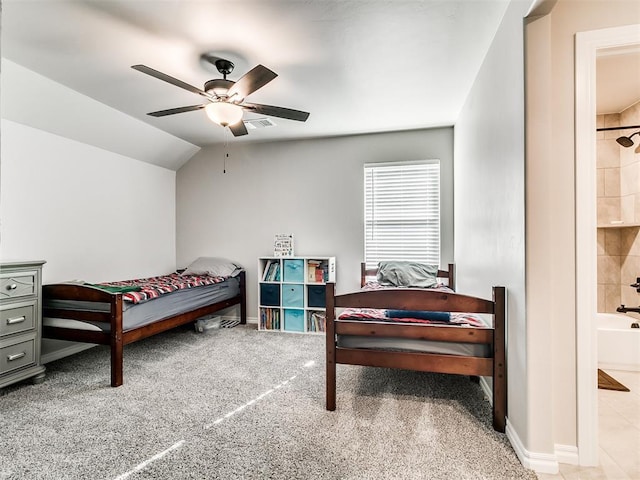 carpeted bedroom with vaulted ceiling, ceiling fan, and connected bathroom