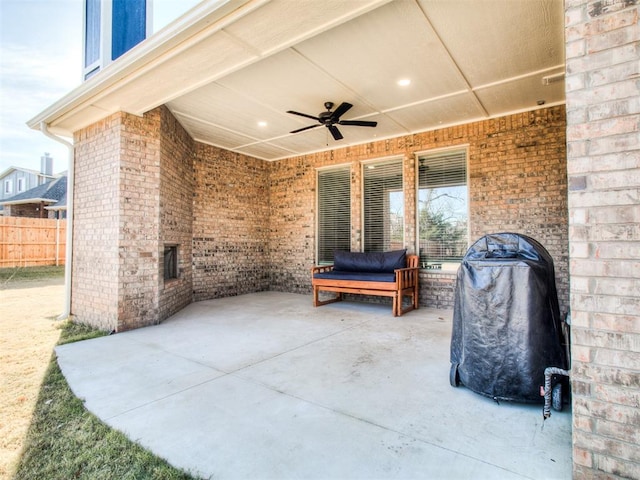 view of patio with ceiling fan and area for grilling