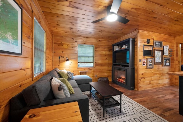 living room featuring wooden walls and wood ceiling