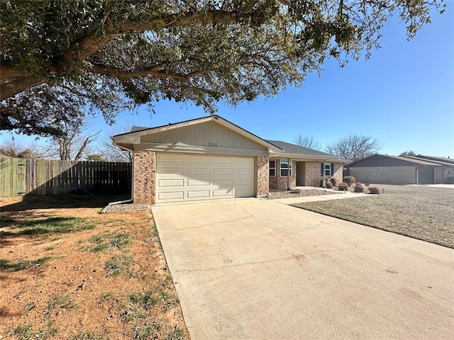 ranch-style house featuring a front lawn and a garage