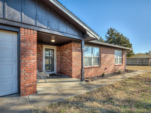 doorway to property featuring a garage