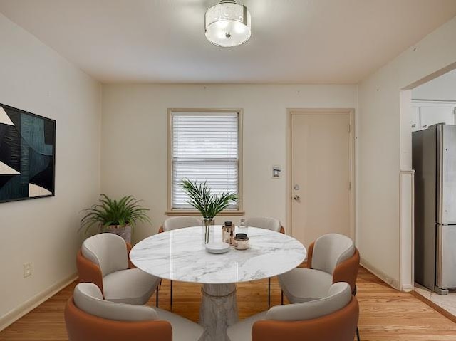 dining space featuring light wood-type flooring