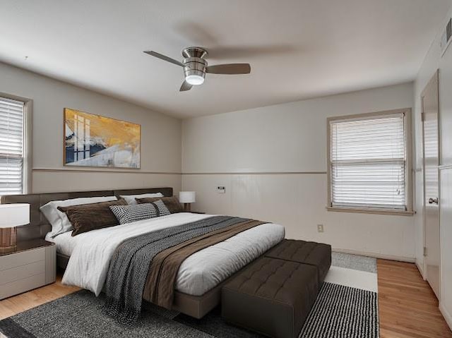 bedroom featuring light hardwood / wood-style floors and ceiling fan