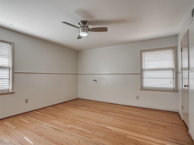 unfurnished room with ceiling fan and light hardwood / wood-style floors