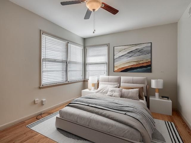 bedroom featuring ceiling fan and light wood-type flooring