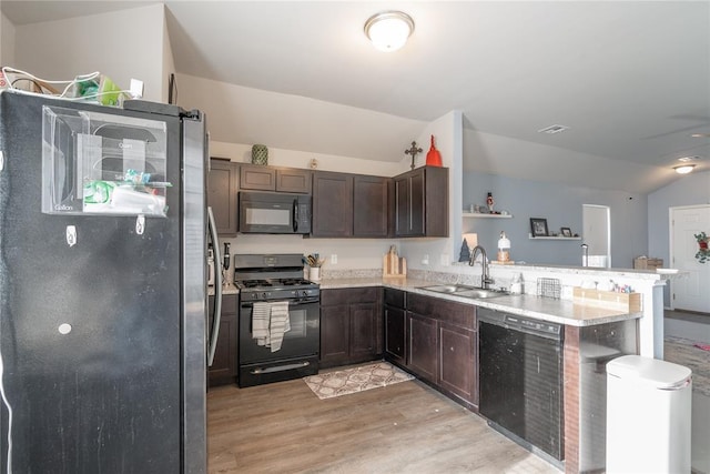 kitchen with sink, light hardwood / wood-style flooring, kitchen peninsula, dark brown cabinets, and black appliances