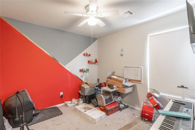 miscellaneous room with ceiling fan and light carpet