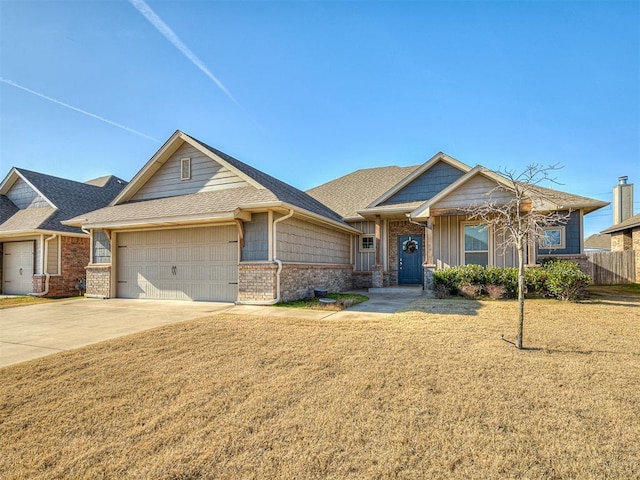 view of front of property with a front lawn and a garage