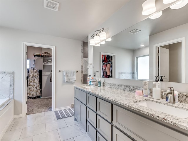 bathroom featuring tile patterned floors and vanity