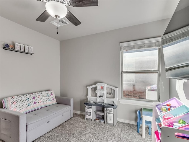 recreation room featuring ceiling fan and light carpet