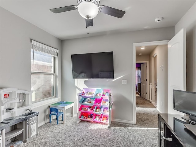 game room featuring ceiling fan and light colored carpet