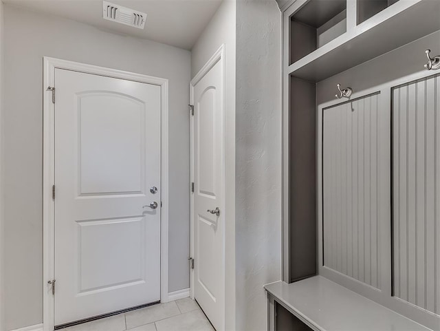 mudroom with light tile patterned flooring